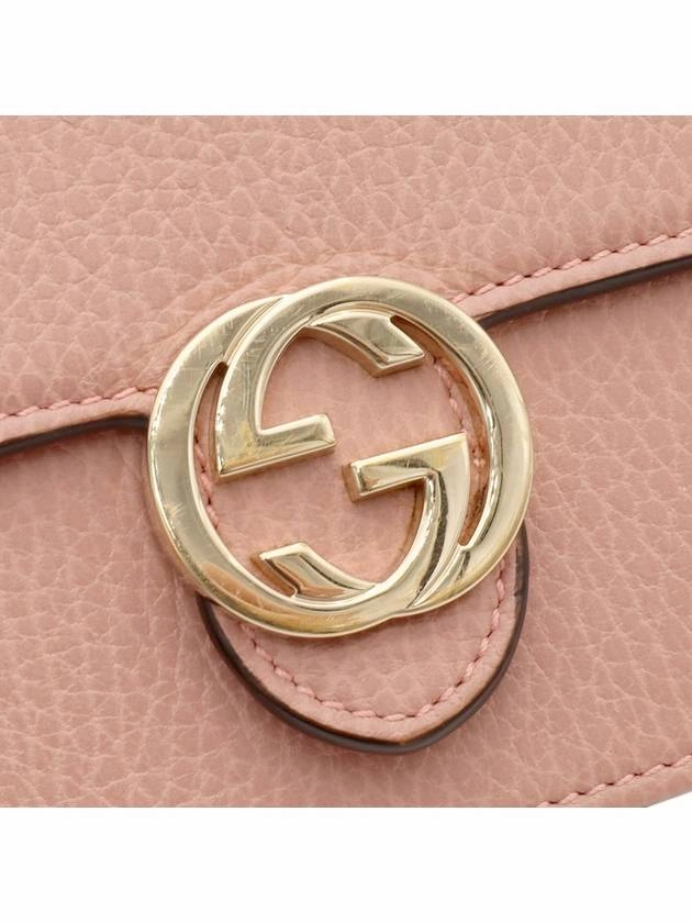 Pink leather interlocking GG chain mini clutch crossbody bag
