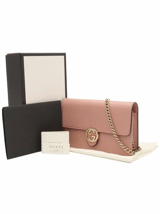 Pink leather interlocking GG chain mini clutch crossbody bag